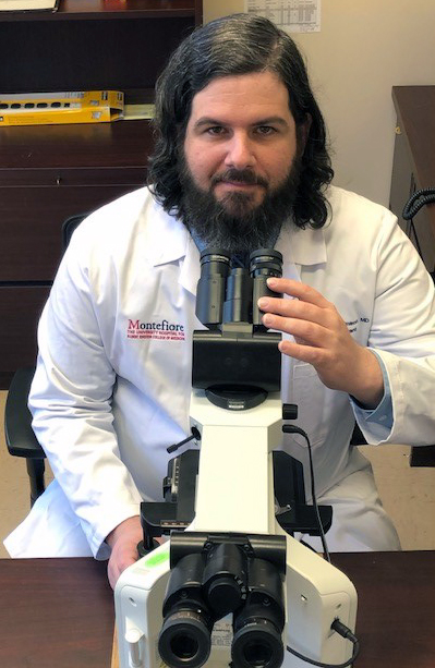 Dr. Dickinson with double headed microscope.