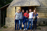 (From left) Einstein medical students Corey Fulcher, Vivy Tran, Joann Anthonypillai, Kedong Wang and Audrey Chan stand in front of a traditional Tukul hut
