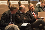 Drs. Blanchard and Schramm listen intently to Dean Spiegel