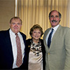 Dr. Smoller flanked by Mike Bornstein and her stepson, Steve Austerer.