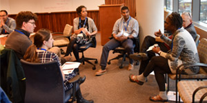 Andrea Littleton, M.D., far right, HOPE faculty adviser, during a breakout session with medical students.