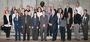 Members of the conference faculty, representing all participating institutions, pose by a bust of Albert Einstein