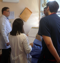 Dr. Efrain Bu (far left) on rounds with residents. Dr. Robles has teamed with Dr. Bu to establish a collaborative global health exchange program between Hospital Escuela and Montefiore’s family and social medicine residency program.