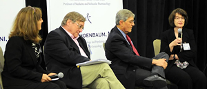 Drs. Spiegel and Schoenbaum take part in a panel discussion during the forum 