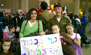 Dr. Schwaber on return to Israel, being greeted by his wife Haggith and daughters (from left), Shakeid, Netta and Nitsan