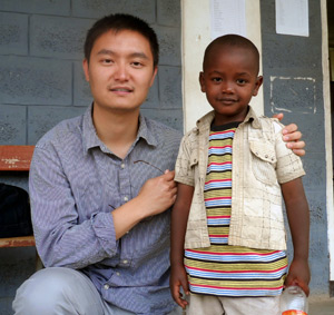 Medical student Kedong Wang with a youngster at a local clinic