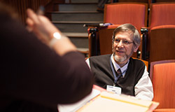 Dr. Louis Weiss, GHC co-director, engages in dialogue with a colleague
