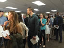 Students line up to receive their envelopes