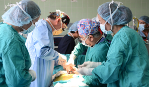 Dr. Michler teaching local doctors during a surgery