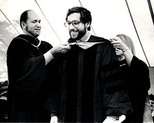 Dr. Baum, as director of Einstein’s MSTP, hoods Dr. Myles Akabas at his graduation from Einstein in 1983