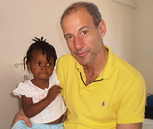 Paul Levin, M.D. with a young patient