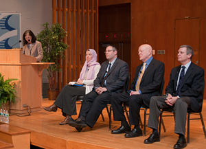 Mimi McEvoy introduces the panelists, from left, Dr. Mattson, Dr. Reichman, Rev. Lokos and Dr. Sulmasy