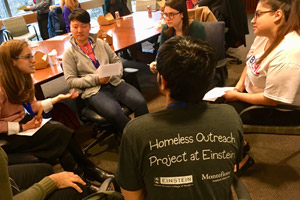 Students from different medical schools share strategies for helping the homeless.