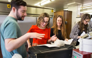 Students review the recipes before getting to work 