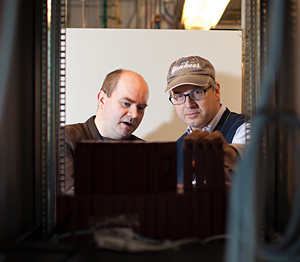 Aaron Golden, Ph.D. and Joseph Hargitai prepare Leo, the supercomputer, to run some computations