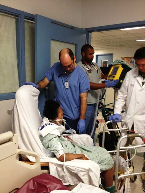 Montefiore ICU physical therapist helping critically ill patient walk